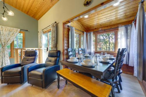 a dining room with a table and chairs at Hot Tub and Pet-Friendly! Gatlinburg Resort Cabin in Gatlinburg