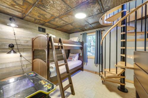 a room with bunk beds and a sink and stairs at Hot Tub and Pet-Friendly! Gatlinburg Resort Cabin in Gatlinburg