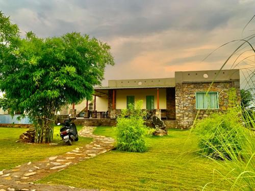 a house with a motorcycle parked in front of it at Sayar Bagh Jawai in Nāna