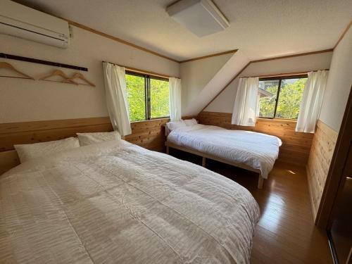 Ένα ή περισσότερα κρεβάτια σε δωμάτιο στο SNK OitaAmasemachi - Vacation STAY 49013v