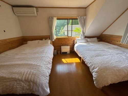 Ένα ή περισσότερα κρεβάτια σε δωμάτιο στο SNK OitaAmasemachi - Vacation STAY 49013v