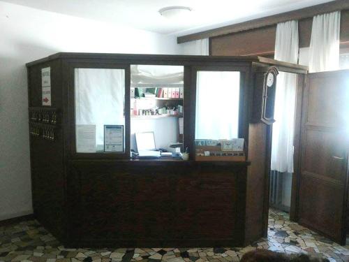 an office with a desk with a computer on it at Hotel Piol in Limana