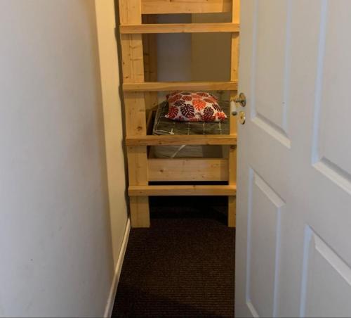 a room with a book shelf with a pillow on it at Artishalico tallinn in Tallinn