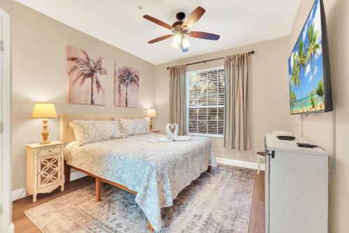 a bedroom with a bed and a ceiling fan at Disney Bunk Room--Windsor Hills in Orlando