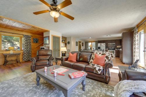 a living room with a couch and a table at Hot Tub and Resort Perks! Gatlinburg Mtn Retreat in Gatlinburg