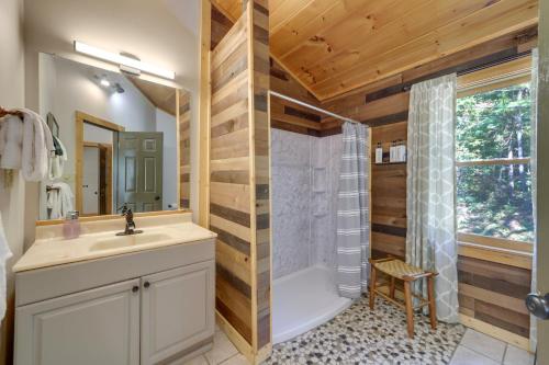 a bathroom with a tub and a sink and a shower at Hot Tub and Resort Perks! Gatlinburg Mtn Retreat in Gatlinburg