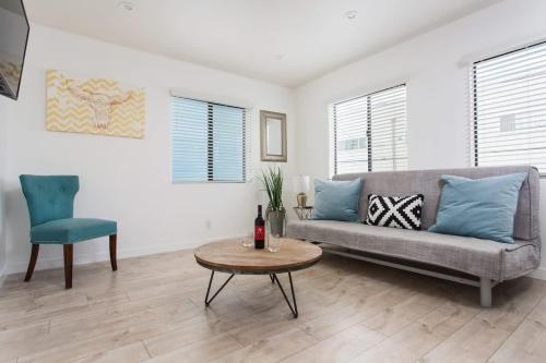 a living room with a couch and a table at Sunny 1 Bedroom in the Heart of Venice Beach - #4 in Los Angeles