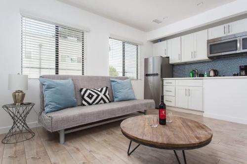 a living room with a couch and a table at Sunny 1 Bedroom in the Heart of Venice Beach - #4 in Los Angeles