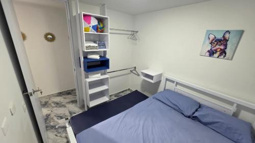 Postel nebo postele na pokoji v ubytování Condominio AZUL RICAURTE Apartamento con 4 piscinas