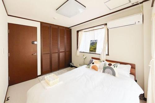 En eller flere senge i et værelse på Heim Mitomi - Vacation STAY 20357