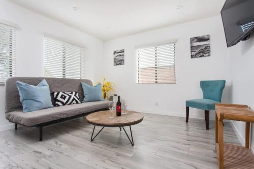 a living room with a couch and a table at Sunny 1 Bedroom in the Heart of Venice Beach - #3 in Los Angeles