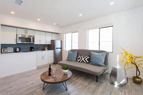 a living room with a couch and a table at Sunny 1 Bedroom in the Heart of Venice Beach - #3 in Los Angeles