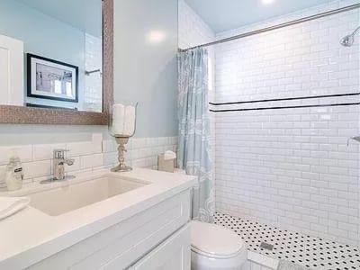 a white bathroom with a sink and a toilet at Sunny Studio in the Heart of Venice - A in Los Angeles