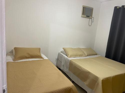 Un ou plusieurs lits dans un hébergement de l'établissement Loft da Praia dos Corais