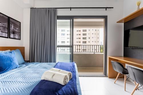 Postel nebo postele na pokoji v ubytování Essential Brooklyn - Stúdio com varanda e academia - By Easy Stay