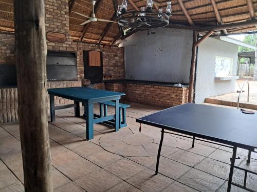 a blue ping pong table in a room with a ping pong table at Greenfield in Klerksdorp
