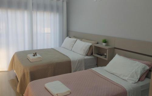 En eller flere senge i et værelse på Sobrado Praia, Beto Carrero Park