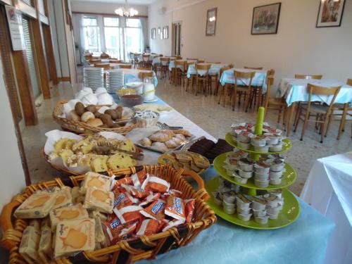 a table with a bunch of different types of food at Casa Caburlotto in Venice