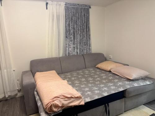 a bed with two pillows on it in a room at Stuga in Gothenburg
