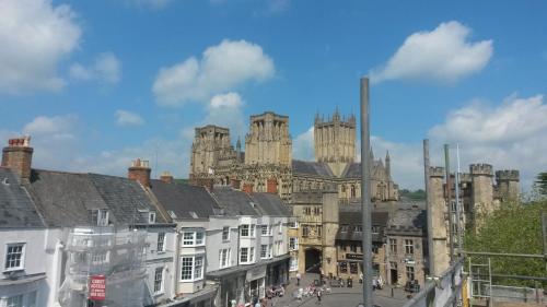 a view of an old building with a bunch of buildings at The Crown at Wells, Somerset in Wells