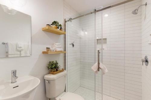 a bathroom with a shower and a toilet and a sink at Santa Rosa in Santa Barbara