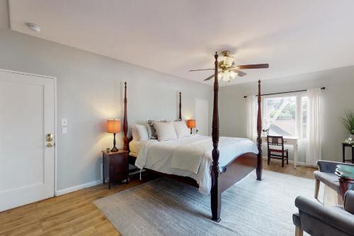 a bedroom with a bed and a ceiling fan at Santa Rosa in Santa Barbara