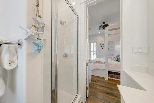 a bathroom with a shower with a glass door at Vida del Mar in Mustang Beach
