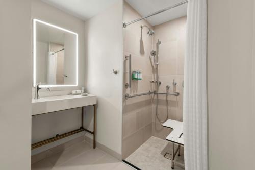 a bathroom with a sink and a shower at The Seahaus Hotel, Atlantic City Boardwalk, a Tribute Portfolio Hotel in Atlantic City