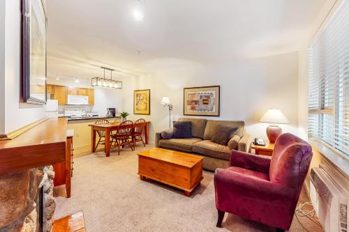 a living room with a couch and a table at Town Plaza, Unit 209 in Whistler