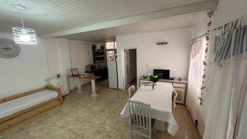 a living room with a couch and a table in it at alaguthe in Olavarría