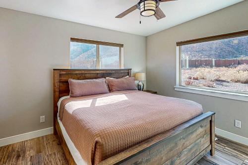 a bedroom with a bed and a window at Rim View 7 in Spanish Valley