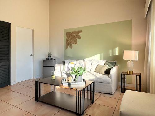 a living room with a couch and a coffee table at Coronado Luxury Club and Suites,Oasis in El Quije