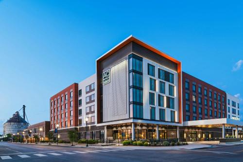 a rendering of a building on a city street at AC Hotel by Marriott Waco Downtown in Waco