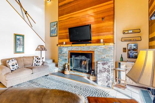a living room with a couch and a fireplace at Timber Ridge 203 in Silverthorne