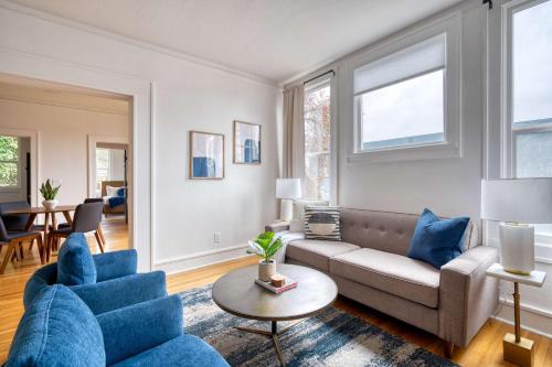 a living room with a couch and a table at Stay Portland - La Casa Burnside - Local Eateries, Shops, and Bars in Portland
