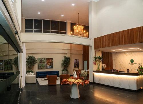 a lobby with a couch and a table in a building at Amazon Park Hotel in Belém