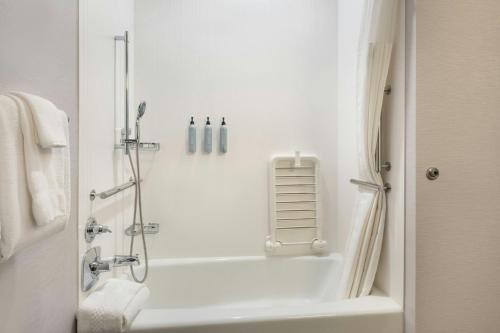a bathroom with a shower and a bath tub at Courtyard Casper in Casper
