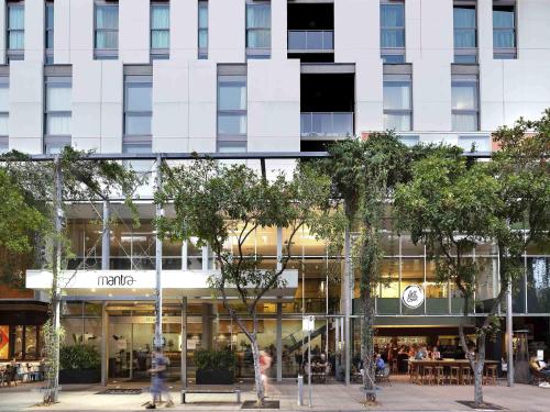 a facade of a building with people walking in front of it at Mantra South Bank Brisbane in Brisbane