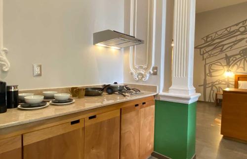 a kitchen with a sink and a counter top at Hotel MX condesa CDMX, Trademark Collection by Wyndham in Mexico City