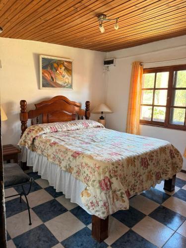 a bedroom with a large bed in a room at Casa cómoda en La Barra in Punta del Este