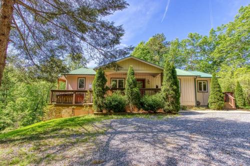 a home in the woods with a driveway at Memorable "Deer & Doe" by HoneyBearCabins 4BR 3BA, Mountain View Deck, Farmhouse Decor, Fireplace, 3 Acres in Sevierville
