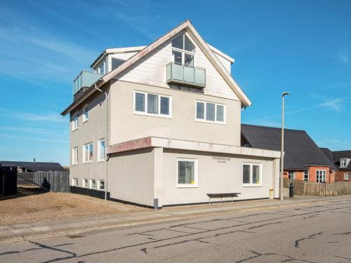 a large white building on the side of a street at 6 person holiday home in Thyborøn in Thyborøn