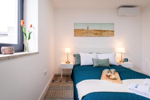 En eller flere senge i et værelse på DesKanzo Guest House - Silva Brinco