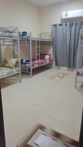 Postel nebo postele na pokoji v ubytování Muscat Galaxy Hostel