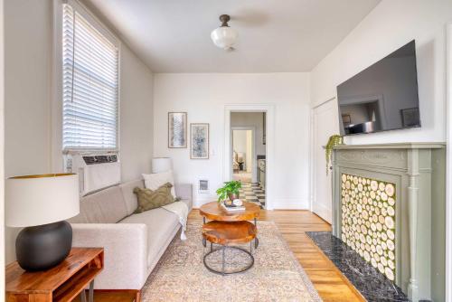 a living room with a couch and a fireplace at Stay Portland - La Casa Burnside - Local Eateries, Shops, and Bars in Portland