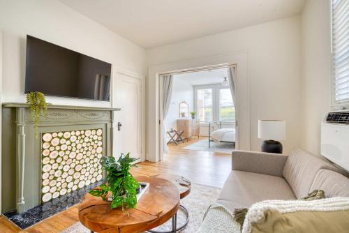 a living room with a couch and a fireplace at Stay Portland - La Casa Burnside - Local Eateries, Shops, and Bars in Portland