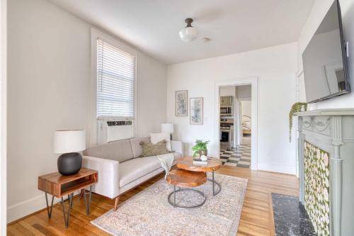 a living room with a couch and a table at Stay Portland - La Casa Burnside - Local Eateries, Shops, and Bars in Portland