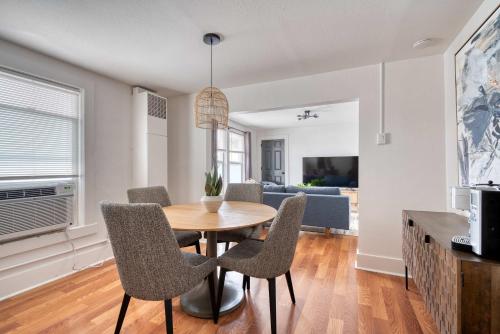 a dining room and living room with a table and chairs at Stay Portland - La Casa Burnside - Local Eateries, Shops, and Bars in Portland