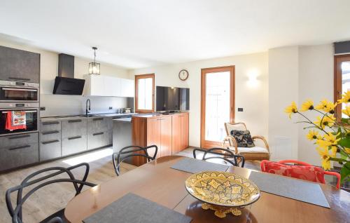 a kitchen and living room with a table and chairs at Gorgeous Apartment In Lamon With Wifi in Lamon