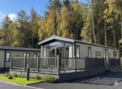 a modular home with a fence around it at Luxury Lodge in Auchterarder